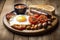 A classic full English breakfast with bacon, eggs, sausages, baked beans, grilled tomatoes, and mushrooms. 